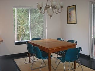 Dining area with treetop views, easy access to balcony