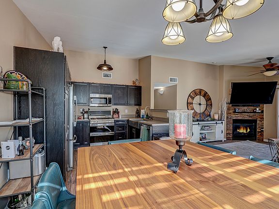 Huge open upgraded kitchen with stainless steel appliances, excellent sized dining area