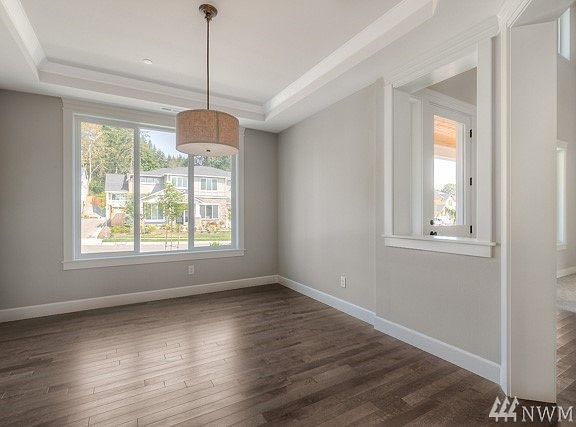 Hampton 4438 sf plan , elevation A ( Lot 8) is under construction, this photo is of another home and floorplan in a different community.  This photo is to be viewed as a sample of the different exterior colors, designs, details and finishes.