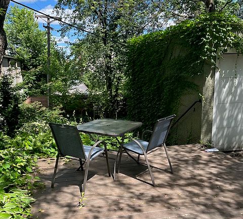 Deck overlooking enclosed backyard