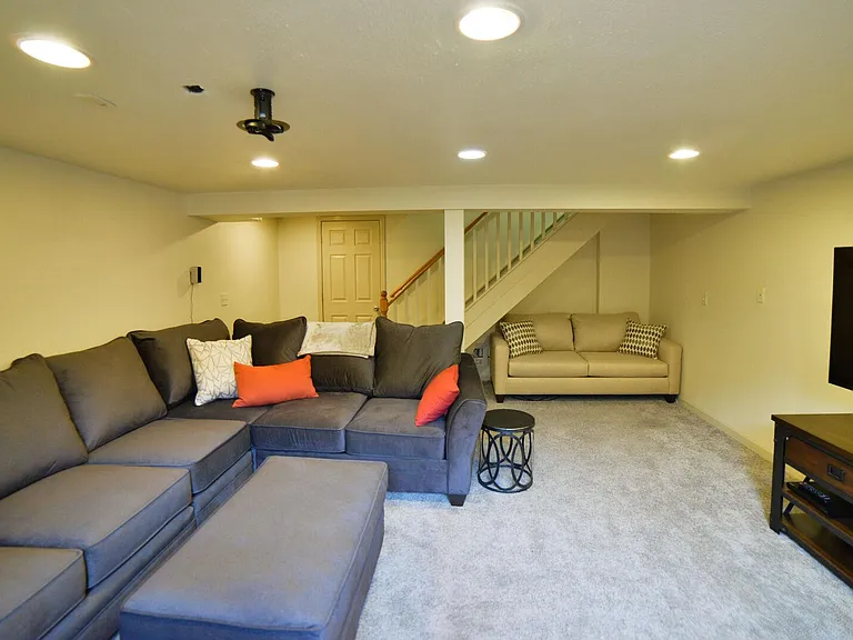 Basement living room with smart tv and surround sound. Sofa Sleeper