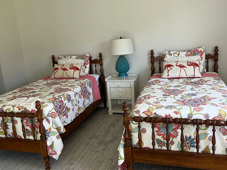 Twin bedroom with new rugs