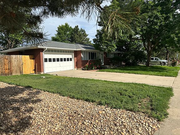 2 car attached garage with additional parking behind the car fence/gate