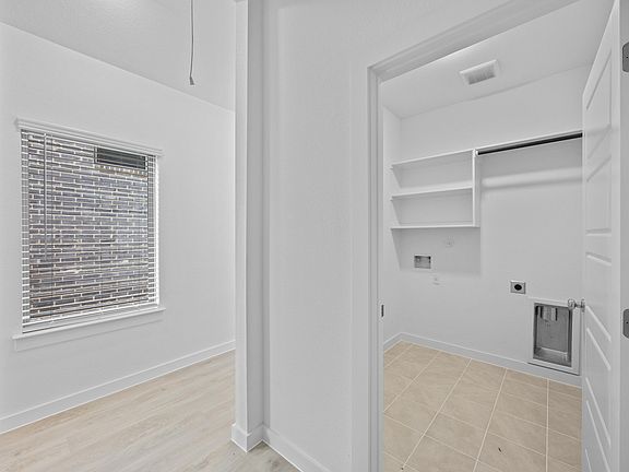 Utility Room in the Pecan II home plan by Trophy Signature Homes - REPRESENTATIVE PHOTO