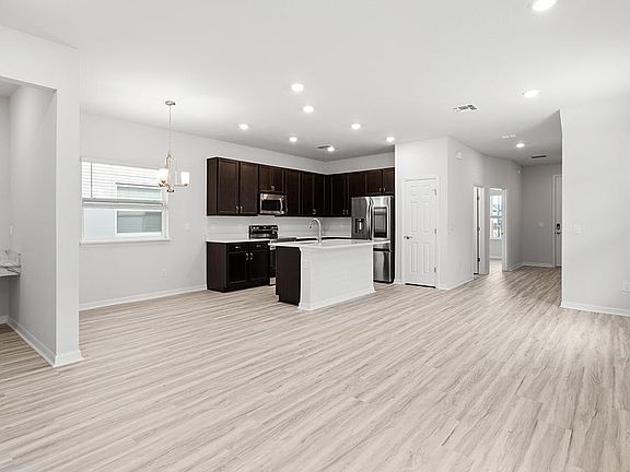 Enjoy a sunny, open living area - Capri bungalow by Highland Homes