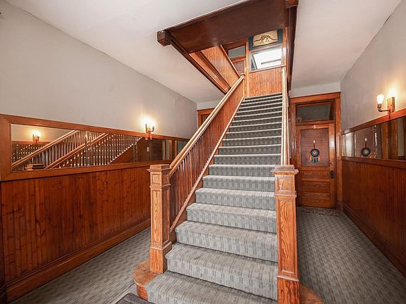 The interior common area and staircase with lots of original 1900s charm
