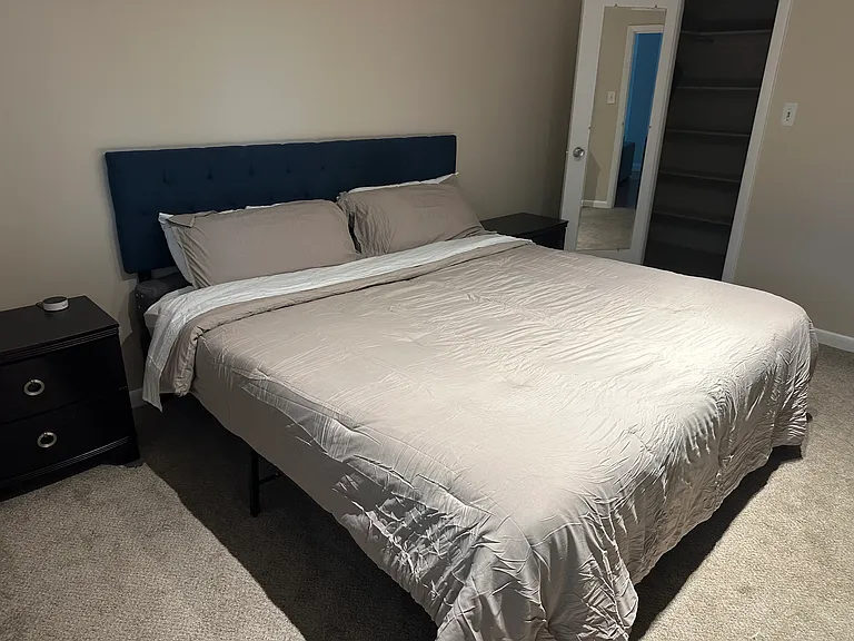 master bedroom with california king new mattress