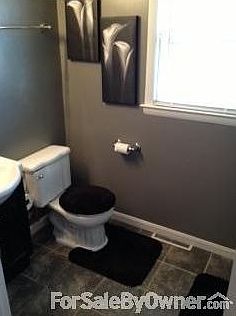 Updated Full Bath w/ceramic tile : Pedestal sink with storage. Access to linen closet & laundry room