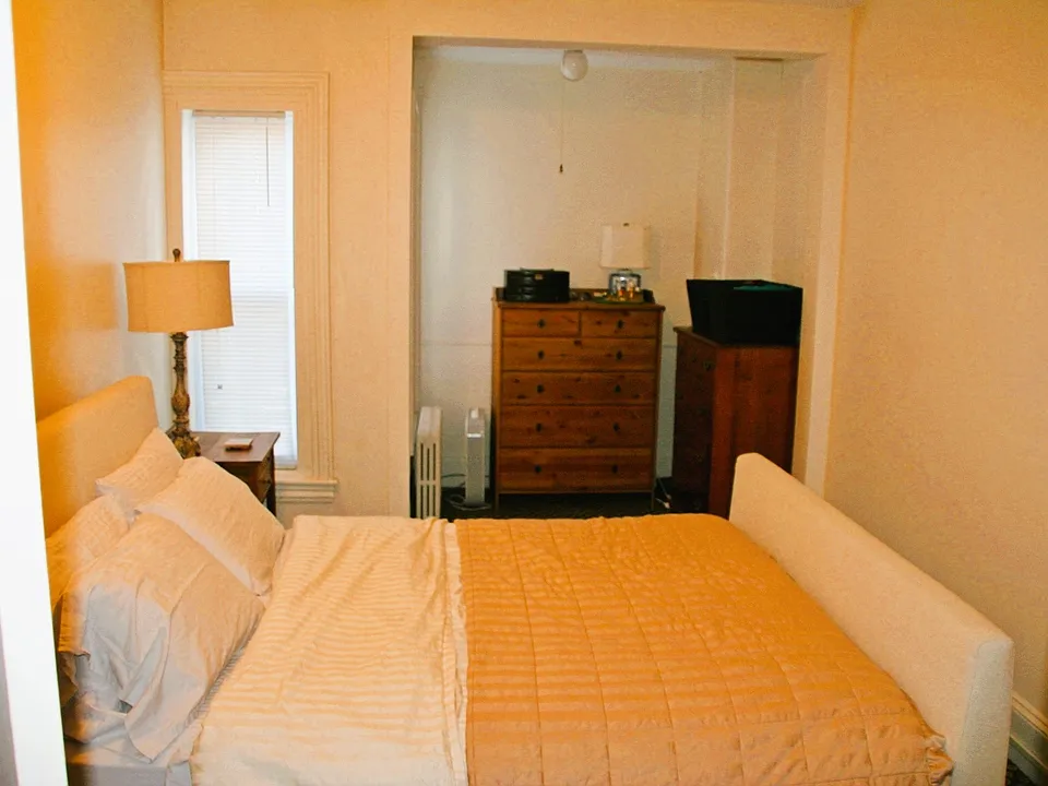 furnished bedroom looking toward alcove