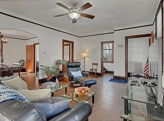 The main spacious rooms flow throughout the main level.  A perfect layout for entertaining.  Note the archway from living room to dining room.
