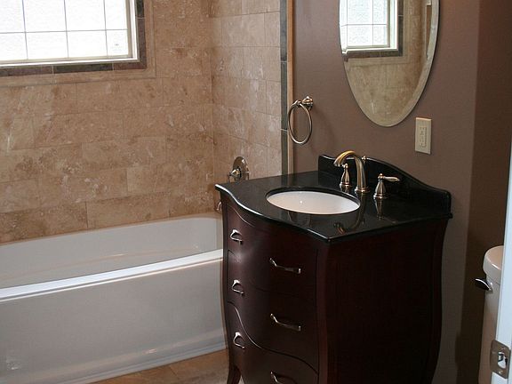Travertine plank hall bath