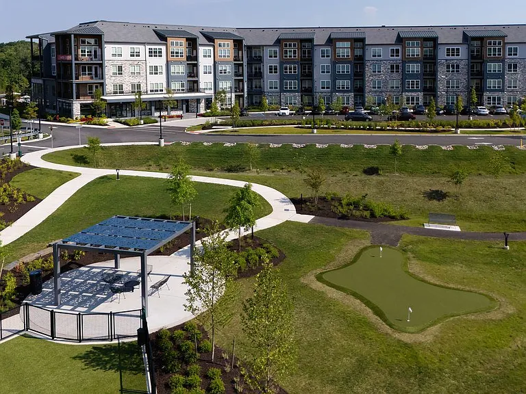 Building exterior with putting green and gazebo