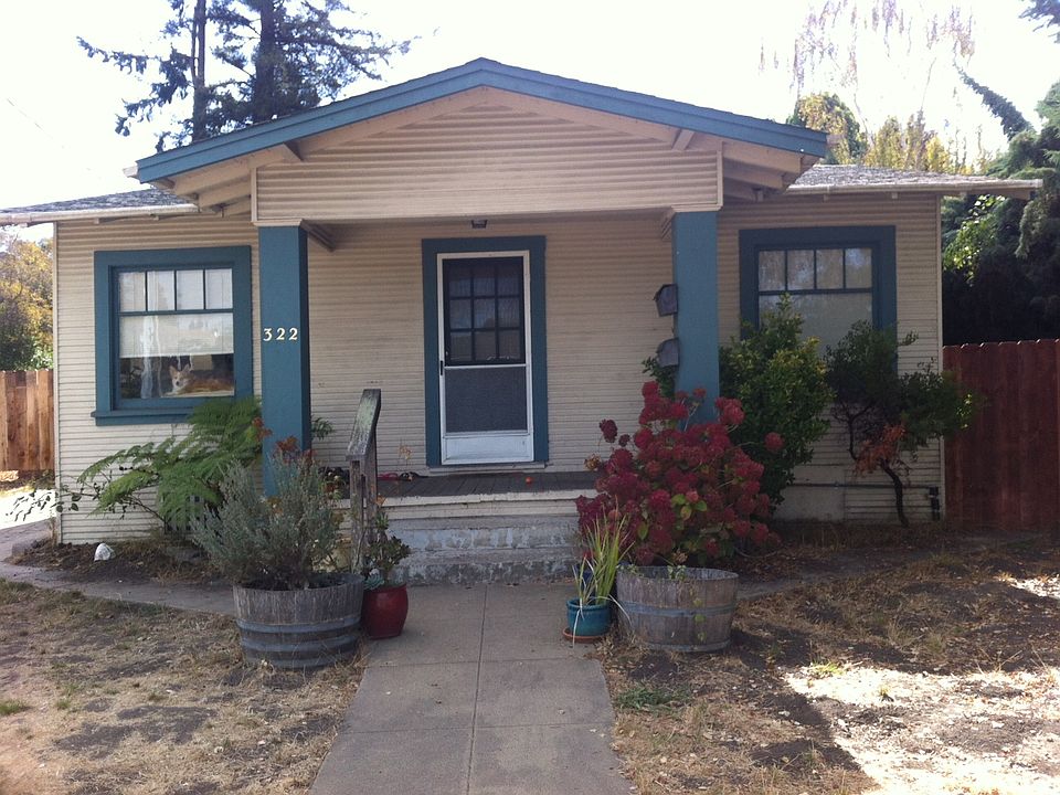 Studio B entrance is in the back and around left side of front of house shown.