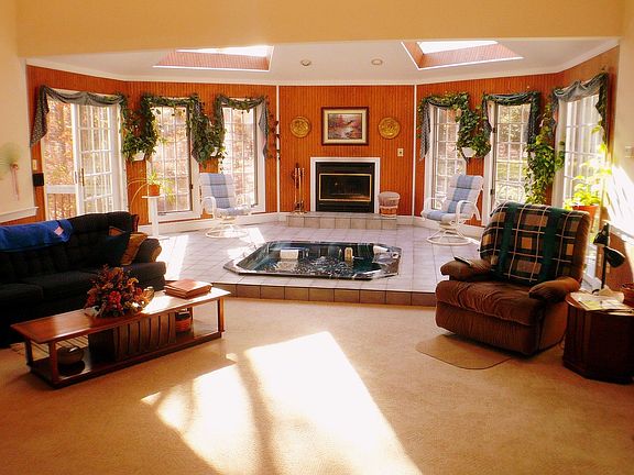 Great Room complete with sunken hot tub and fireplace