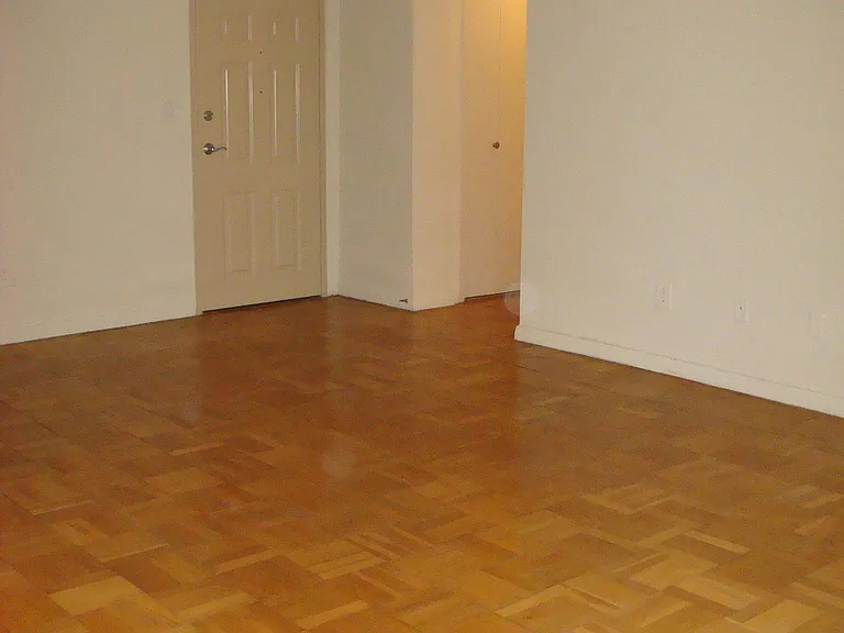 Apartment #307 entry and sunny living room.