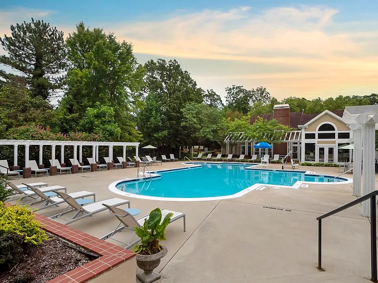 Swimming pool and sundeck with lounge seating
