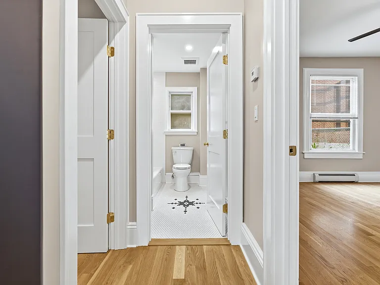 The bathroom sits between the two bedrooms and features natural light as well as beautiful lighting. The designer tiling on the brand new bathroom sparkles in your new oasis. It's all in the details!
