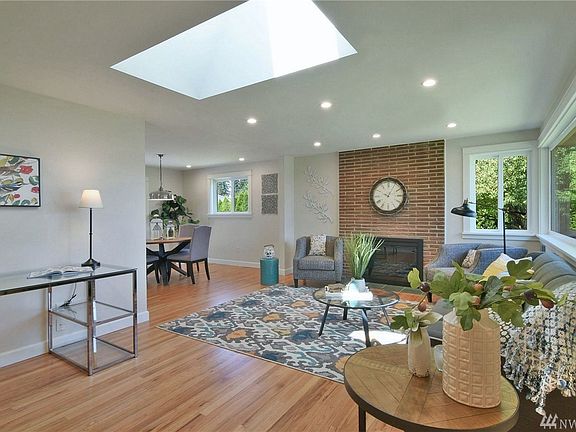 Living room with remote solar censored skylights. Milgard windows