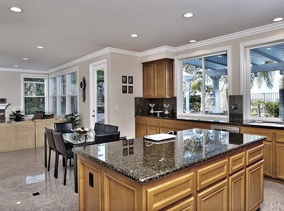 Fabulous Center Island Granite Kitchen with Ample Maple Cabinetry and Upgraded Stainless Steel Appliances
