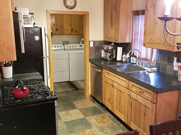 Fully furnished kitchen and separate laundry room.