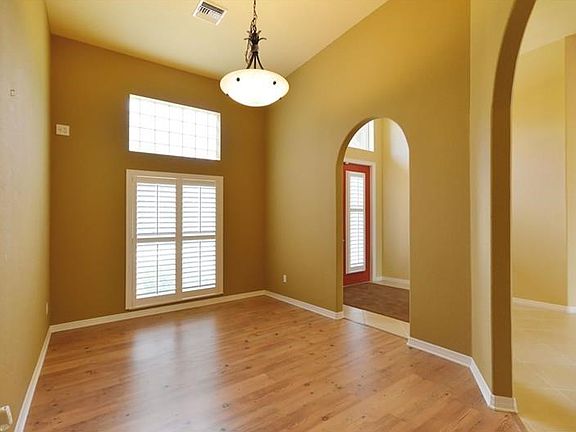 Formal dining room off of kitchen and entry.