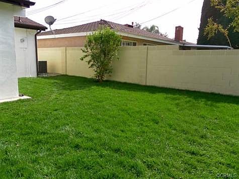 Large all new grass for kids or dogs to run around.