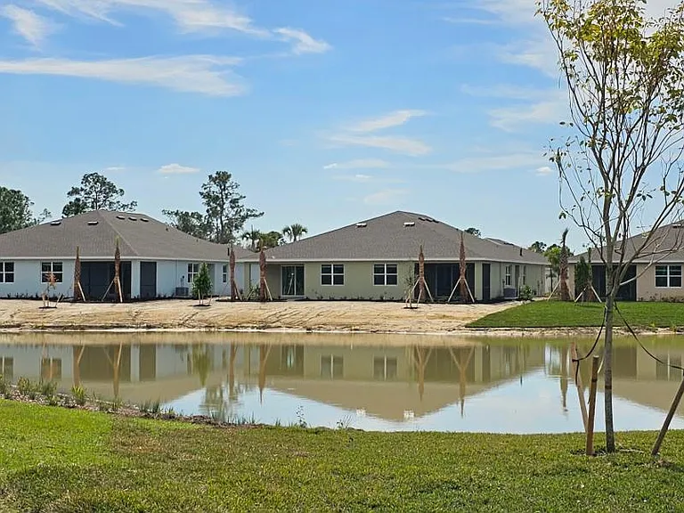 View from across pond. Last Villa on left next to hiking trail