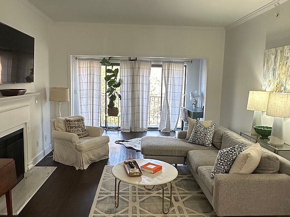 Living room area with sunroom