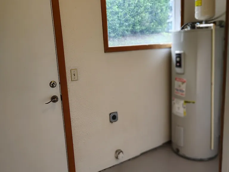 Laundry room w/ hook ups. Tenant furnish their own washer and dryer