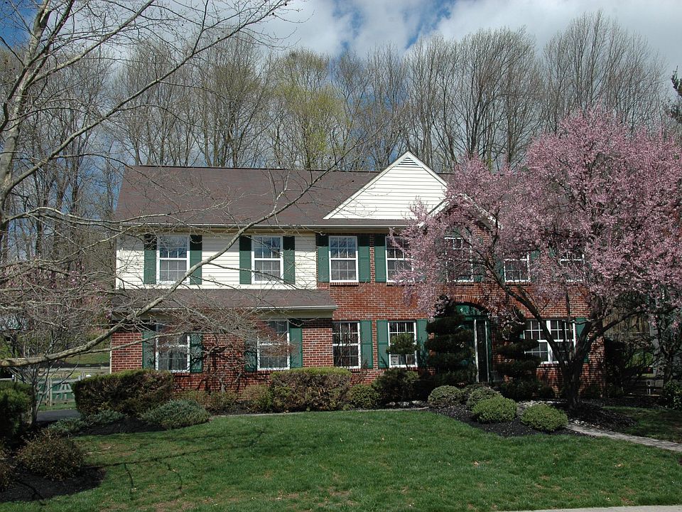 Front Exterio With Wooded Backdrop
