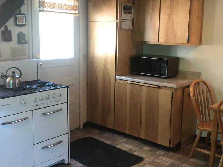 Microwave included. Vintage Wedgewood stove.