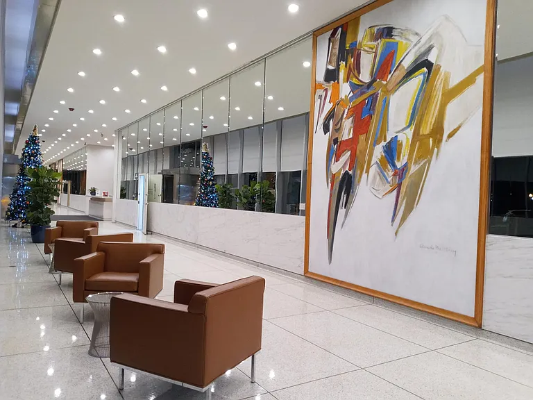 Mid-century modern building and decor. Corbusier and Mies van der Rohe styled furniture.