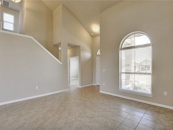 Foyer and living room has cathedral ceilings! Lots of great space!