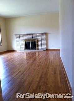 Living room : Oak hard wood floors with fireplace
