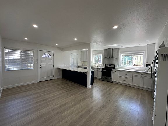 Bright & open layout with wide-plank floors and recessed LED lighting.
