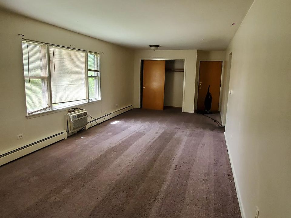 LIVING ROOM. Carpet being replaced with wood floors.