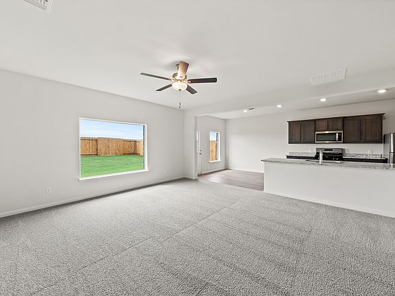 The first floor of the Gideon plan has open living spaces.