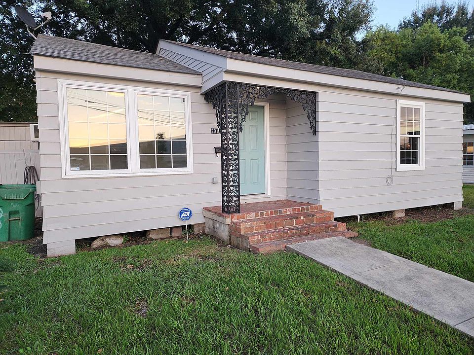 Front of home, driveway on the left side of home. Home is on the corner