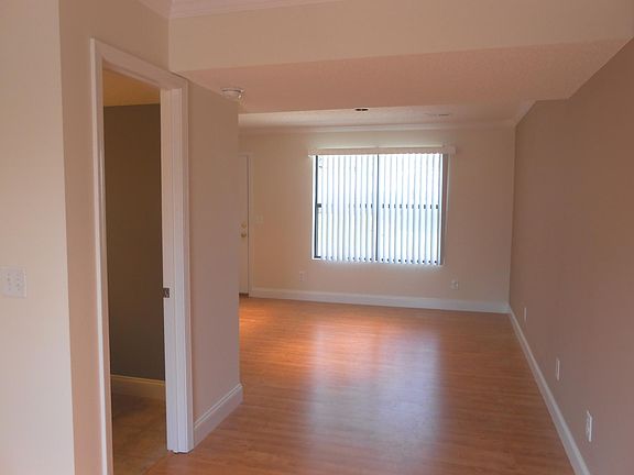 Another view of living room, half bath to left side.