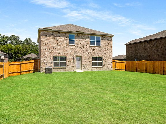 The back yard of the Driftwood is fully fenced-in.