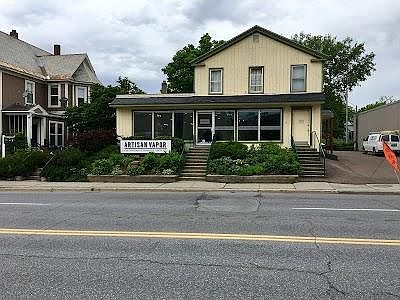 3 windows above commercial spot are bedrooms 1 & 2