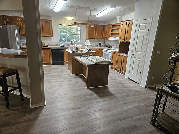 Den looking in to kitchen