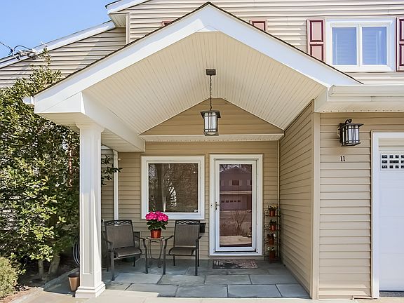 Enjoy the covered portico, bluestone entry and walkway to the custom front door. Or pull right in to your 2-car, remote controlled garage that leads convenient into the entry foyer, along with professional landscaping and lighting, and new siding, these e