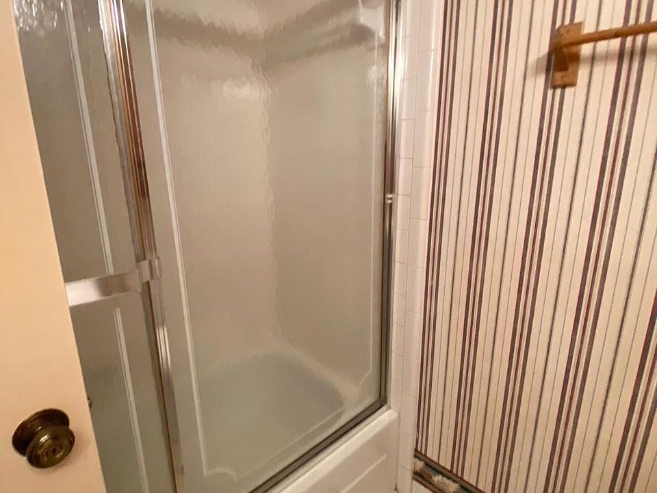 Hallway bathroom with shower