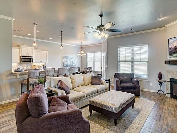 Natural sunlight brightens the kitchen and living area.  The wood styled 2" blinds adorn the windows throughout the home.  Better than new!
