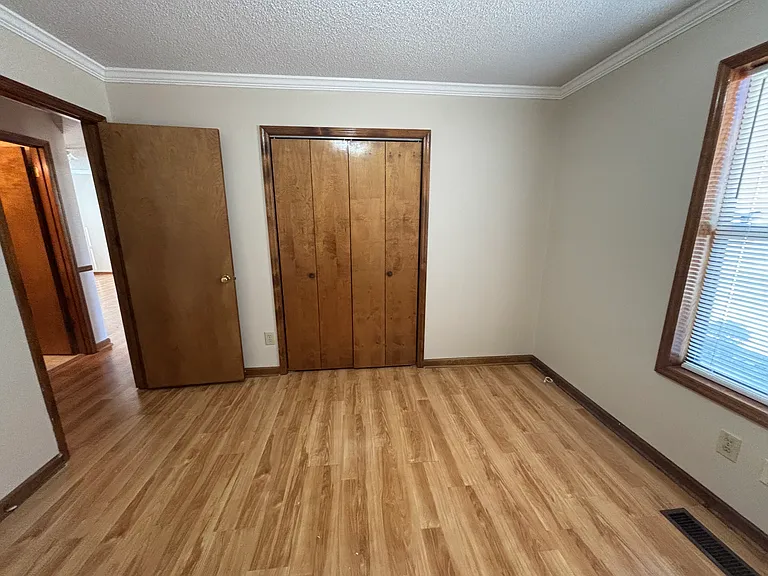 Bedroom 1 facing double closet