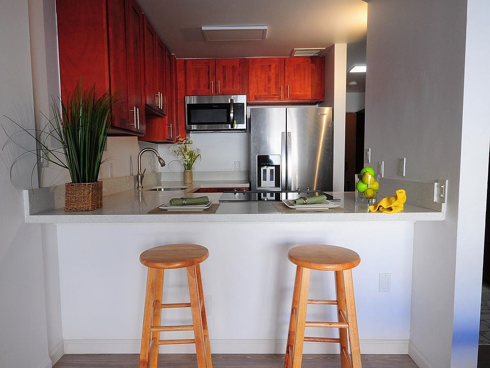 Newly renovated kitchen and floors. The kitchen has an extended countertop, which can also serve as a dining table.