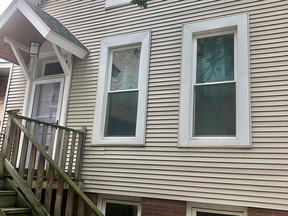 Front of coach house, steps and porch has been repainted