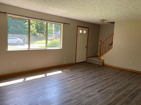 Formal living room with newer luxury vinyl flooring.