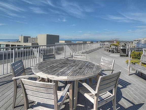 bbqs on roof top deck and seating area